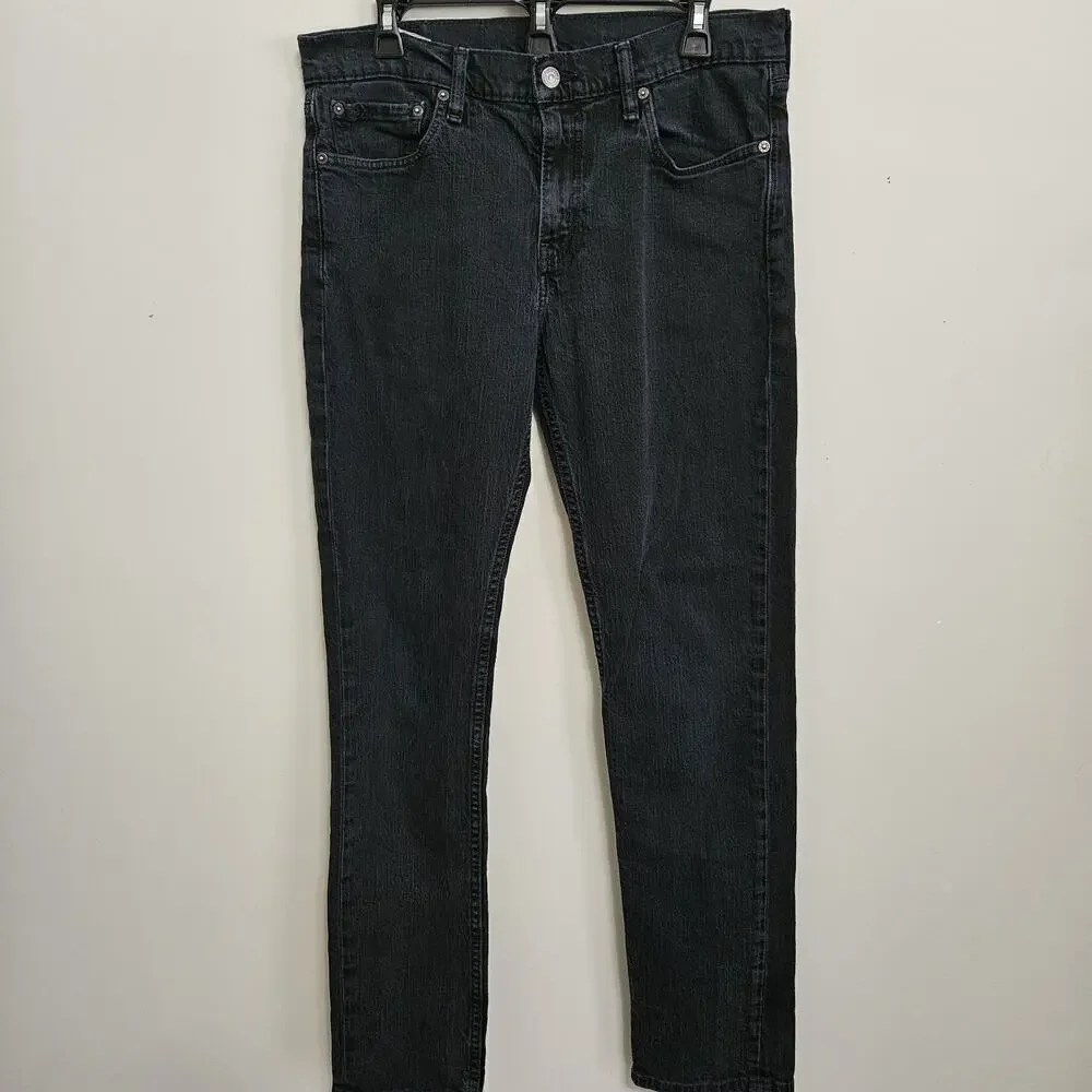 Levi's Men's Regular Fit Jean, 33Wx32L measures 31.5 Black VGUC
